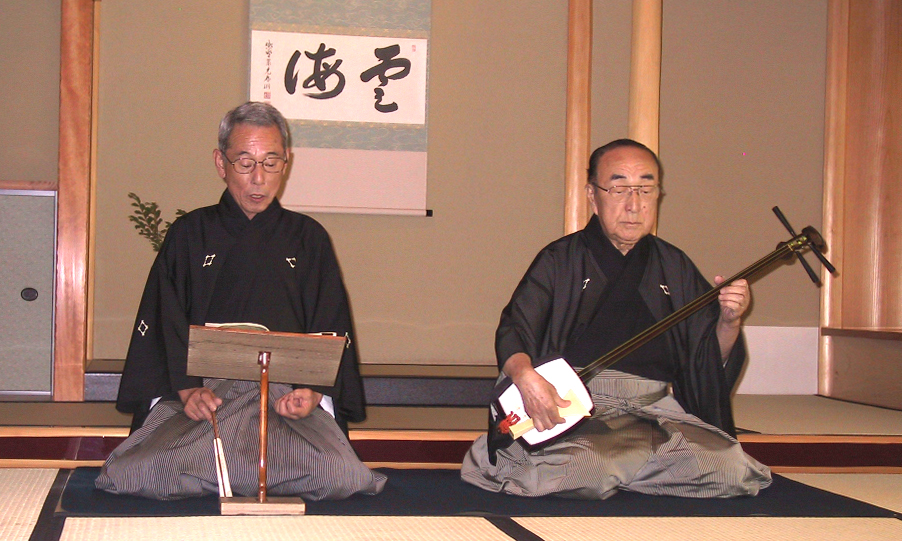 Man_playing_shamisen.jpg