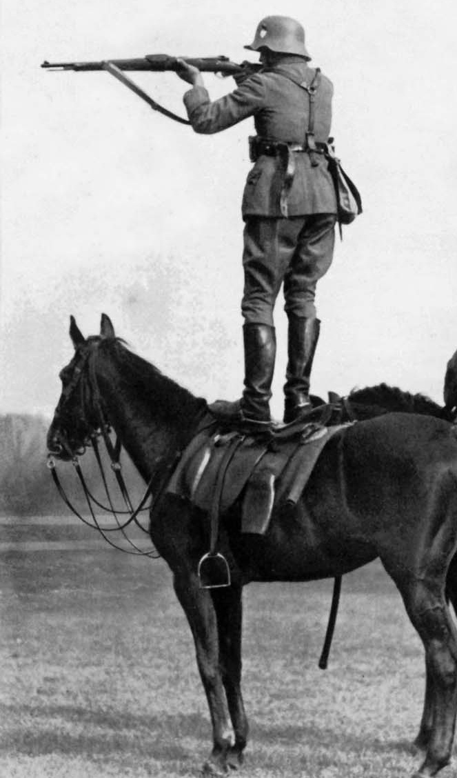 German soldiers take aim from the backs of horses, mid-1930 1.jpg